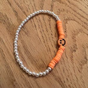 Orange clay bead
